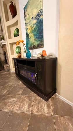 Gorgeous fireplace /tv stand with 5 different colors of flames 70” inches long