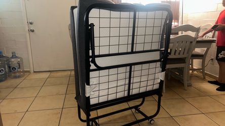 Folding bed with mattress