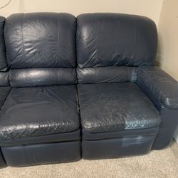 Free Blue Leather Couch, Two Reclinable Seats, Some Wear And Tear On The Edge Of The Cushions