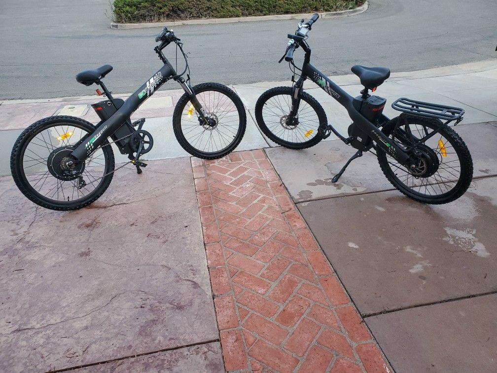 Two Electric Bikes With Throttles Plus Bike Rack