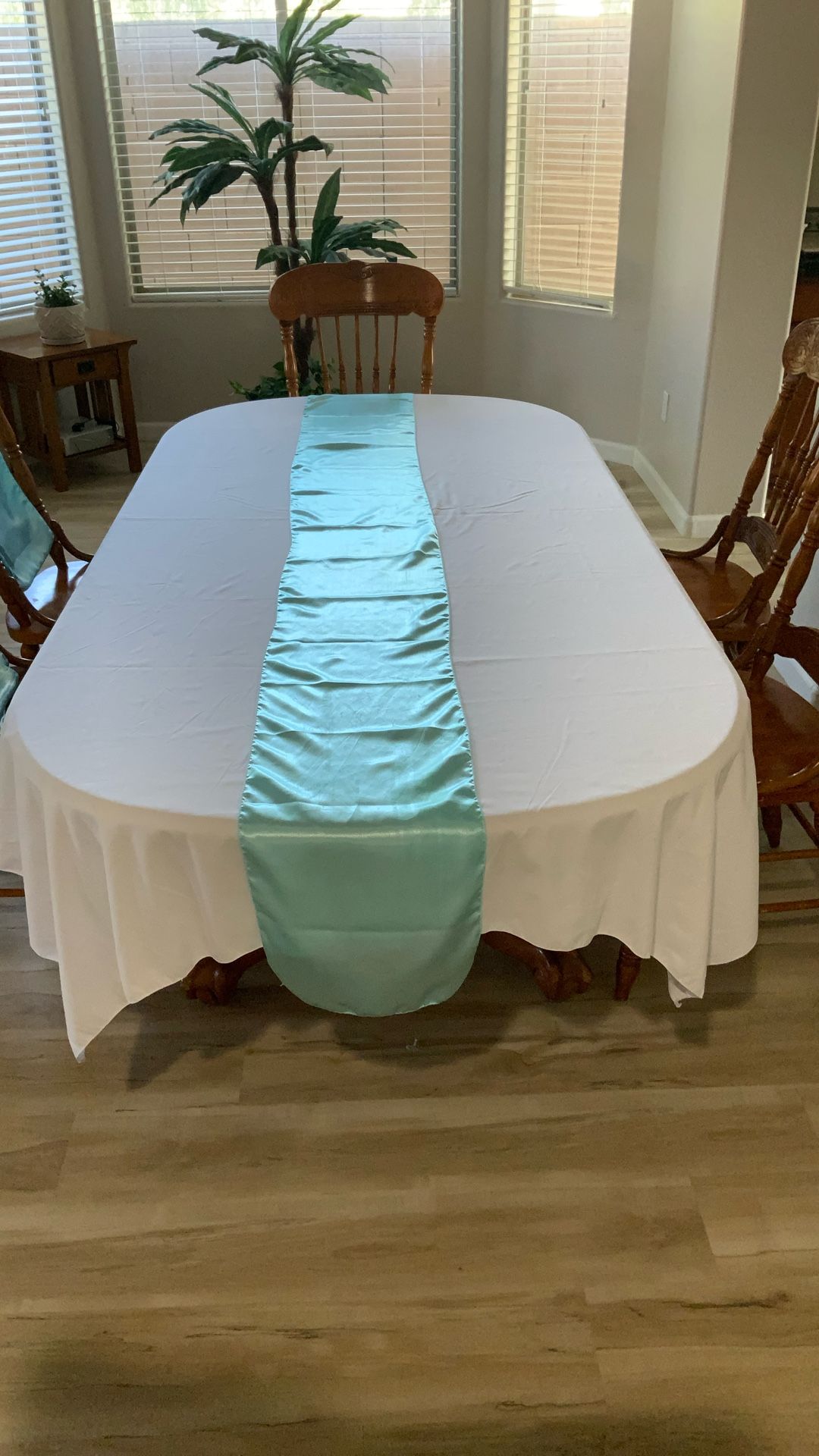 White Tablecloths & Turquoise Satin table runners