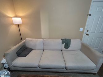 Cream couch with wood legs