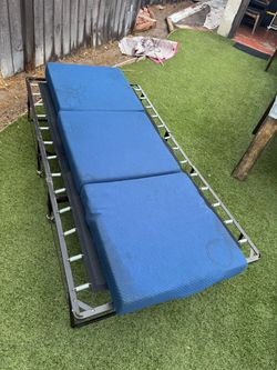 Foldable bed frame on wheels comes with foam pad size twin $100