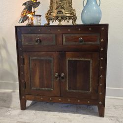 Artisan storage cabinet with metal accents