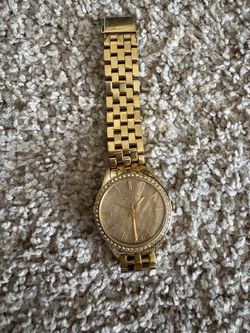 DKNY Gold-Tone Women’s Watch, pre-owned and in good condition. Only needs a new battery. $40.