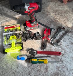 Cordless hand drill with tools