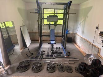Smith machine with dual cable pulley system + full Olympic bar + weights