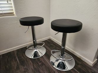 Pair of Black and Chrome Swivel Bar Stools