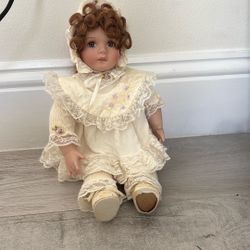 Cute vintage doll with curly brown hair