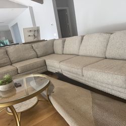 beige fabric L-shaped sectional sofa