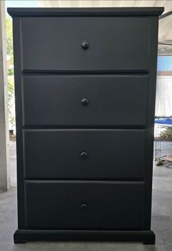 Tall wood dresser.