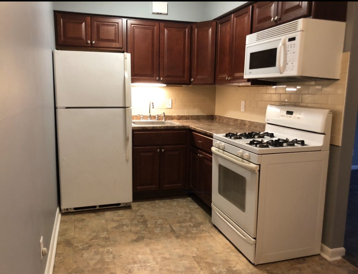 Entire kitchen for sale, cabinets, range, microwave and refrigerator