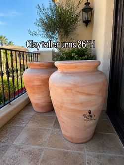 Taller clay urns $90ea