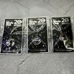 Lot of (3) Disney Movie Club 20th Anniversary collectible pendants featuring the character Simba from The Lion King. The magic lamp from the movie Ala