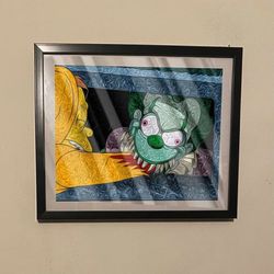 Art piece of Krusty the clown as it pennywise in black frame