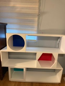 White Modular Bookcase with Colorful Geometric Cutouts