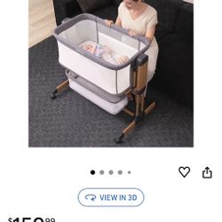 Bedside bassinet adjustable and on wheels with rocker and storage