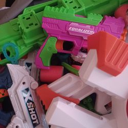 X Shot Nerf Gun With Bullets,target Etc And About 9 Guns In Differnt Sizes.