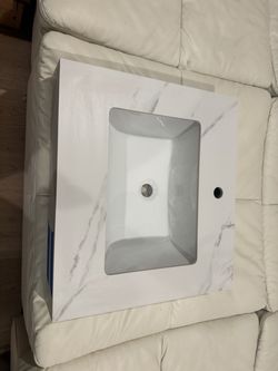 Porcelain sink and custom calcatta countertop