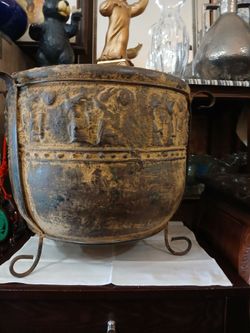 tarnished, footed metal planter