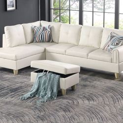 White leather sectional couch and ottoman