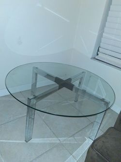 Round glass dining table with metal base