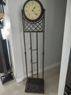 Eclectic Decorative piece with a clock it is battery operated and works, plant holder heavy sturdy 16 X 5ft needs little TLC