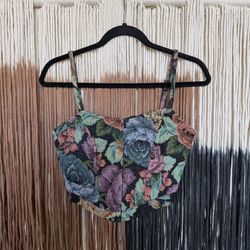 Floral corset top with a hook and eye clasp front and adjustable tie straps on the back; perfect condition