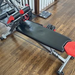 Bench For sit ups, and 20-30 pound adjustable dumbells