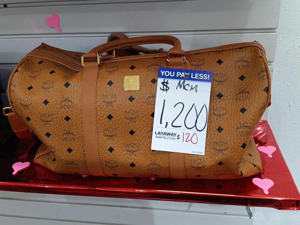 Louis Vuitton Duffle Bag. MCM Duffle Bag 