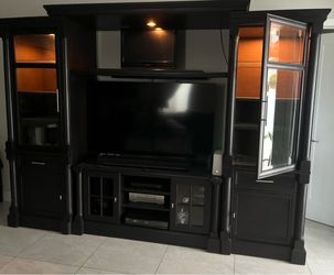 Entertainment center. Fits a tv up to 60” or bigger. Has dimmer lights