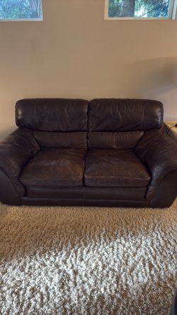 Leather couch, loveseat and storage ottoman