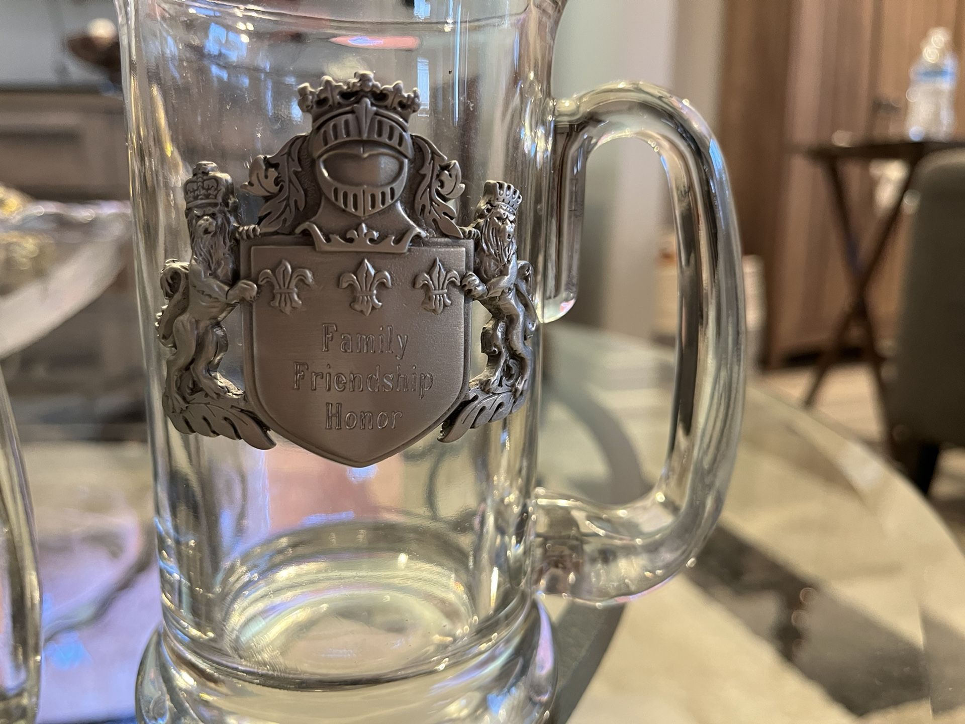 Beer Steins. Very heavy. Front of steins engraved with “Family Friendship Honor”. Perfect condition.
