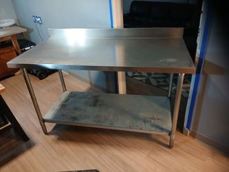 60 x 30-inch standard stainless steel worktable with a backsplash
