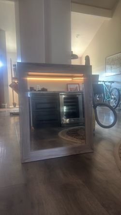 Grey framed bathroom mirror