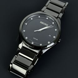 Seiko Men's SNE243 Quartz Solar All Black Dress 12 Diamonds Black Dial Watch