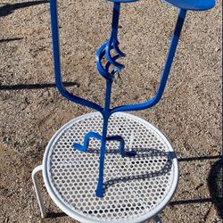 Bright Blue Wrought Iron Candle Holder. Measures 21in tall by 13 1/2in wide. 