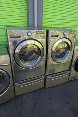 LG Front Load Washer and Dryer Set on pedestals