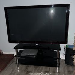 A 60 Inch Samsung TV And With Stand