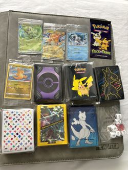 Lot of a bunch of pokemon card extras and accessories. Hundreds of etb sleeves and other stuff