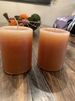 Two brand new pillar candles