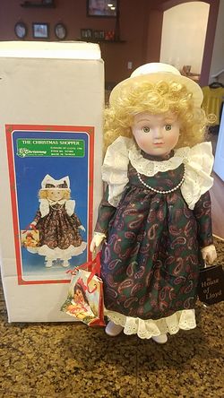 1990 House of Lloyd porcelain doll the Christmas Shopper. From Christmas Around the World.