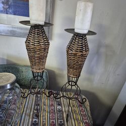 two metal and Wicker candle holders and csndles