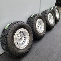 17" KMC rims w/ 33" TBB tires.