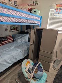 Metal closet with drawers and shelf