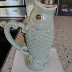 Chinese Craftsmes Ishing "Gluggle Jug" or 'Gurgle Pot" 