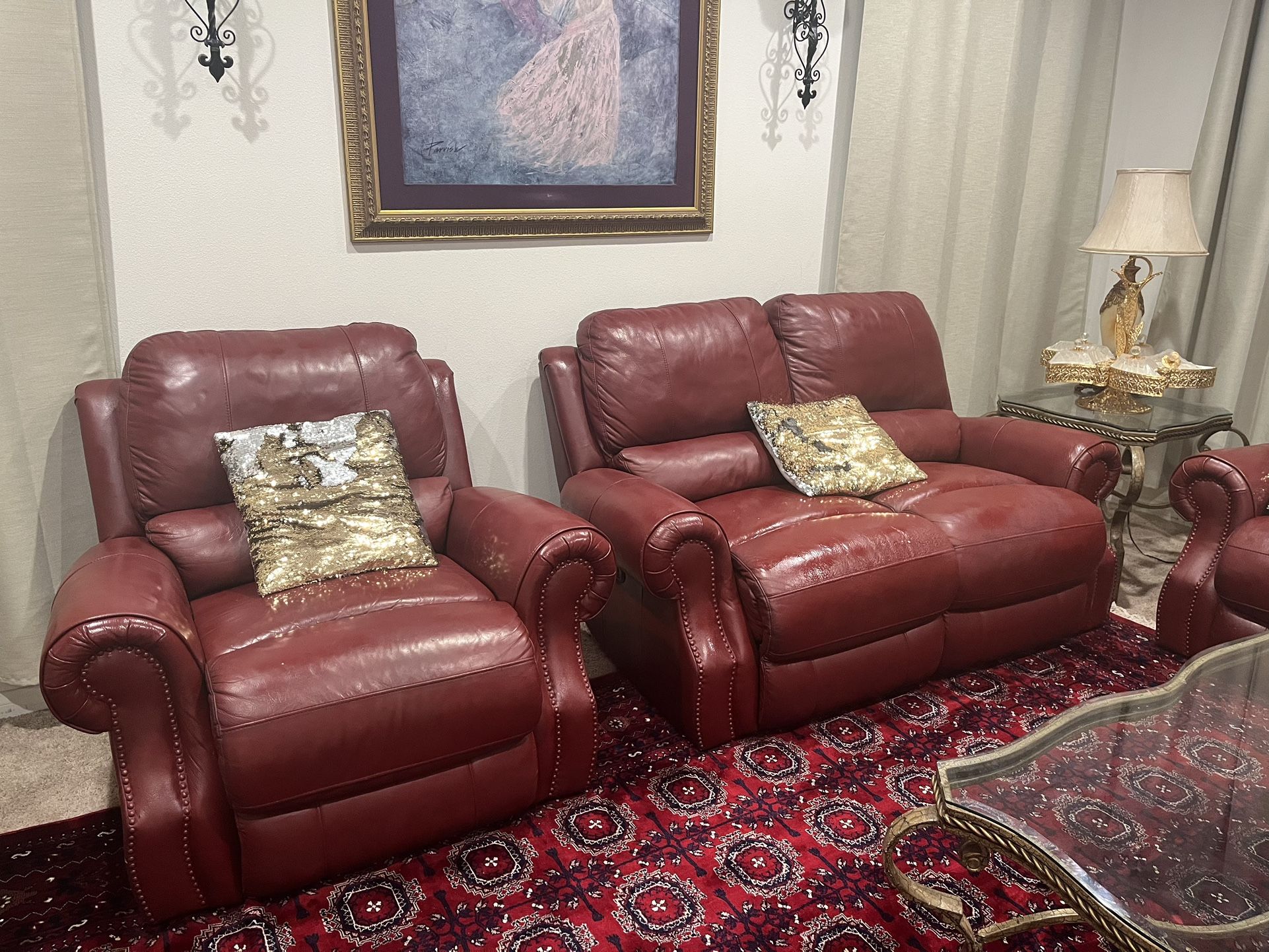 Red leather reclining sofa