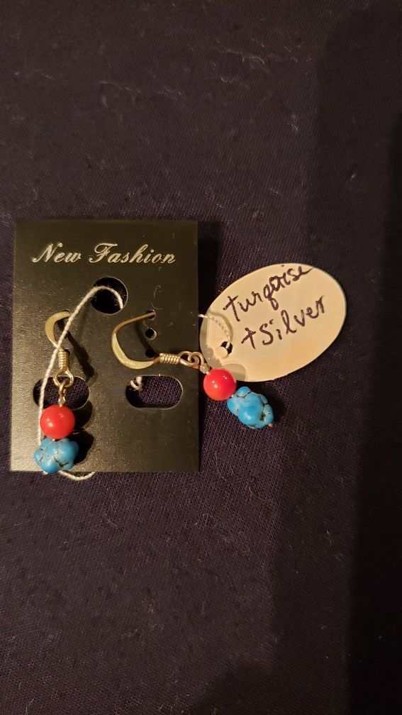 A pair of Silver and real turquoise stone