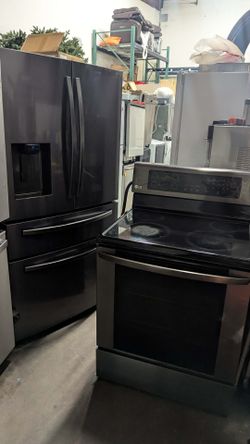 Dark stainless steel range and refrigerator