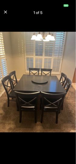 Black solid wood dining table with 8 chairs